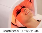 Led phototherapy for the face. LED lamp for photodynamic therapy. Face care. Light therapy at home.