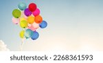 Small photo of multi colored balloons done with a retro vintage filter effect. concept of festival, celebration, birthday, for background design.