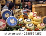 Small photo of Turin, Piedmont, Italy. -10-22-2010- The food fair "Salone del Gusto". Tasting Marzolino cheese.