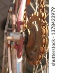 Small photo of the rusty part of a bike chain and its freewheel on an old bike