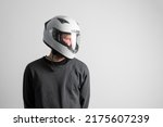Small photo of male rece driver wearing white protective helmet