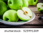 organic green juicy apples on a rustic wooden background