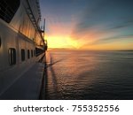 View from the bridge to the stern of the ship during a stunning sunrise somewhere on the Atlantic