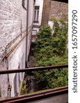 Small photo of Bruges, flanders, Belgium. August 2019. View on the skimpy alley that leads to the historic de garre brewery: cobbled street and brick walls. We are in the heart of the historic center.