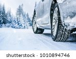 Winter Tire. Car On Snow Road....