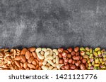 Mix Nuts On Dark Stone Table In ...