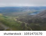 Small photo of Intentionally lurred sped up effect panoramic landscape from Twelve Bens Mountains in Connemara, Ireland