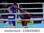 Small photo of BIRMINGHAM, ENGLAND - AUGUST 4: Neville Warupu of Papua New Guinea punches Tyler Jolly of Scotland during the Men’s Over 63.5kg-67kg (Welterweight) - Quarter-Final fight on of the Commonwealth Games.