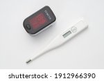 Top view of portable digital fingertip oximeter and thermometer 