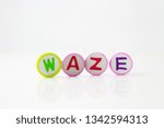 Waze word background made up from alphabet printed round shape eraser