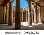 Small photo of Columns in the grand chamber of an ancient carved stone burial tomb at an archaeological site in Paphos, Cyprus.