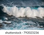 Small photo of Giant waves of the Southern Ocean crash onto the rocky shore of Kangaroo Island off the coast of Adelaide in South Australia in a tumult of foam and spray. A great poster or print for home or office.