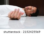 Small photo of Adult Asian man fainted in the floor