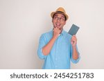 A man holding passport looking...