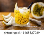 Small photo of Passion Fruit Chairmanship of Brazil on wooden background. Mojitos cocktail, delicious summer drink