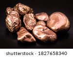 Small photo of native copper nuggets isolated on black background, ore for industrial use in electrical wires and household utensils