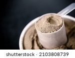 Small photo of measuring spoon with casein and creatine, powdered food supplements, protein or amino acid used by athletes