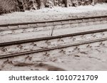 Small photo of Railway lines in the snowy night with special lights and lambency.