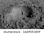 Small photo of Traces of steps on the moon's surface in a soft light. Space travel through spaceflight companies in the near future to planets that can support life. The future of humanity on Mars.