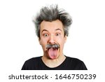Small photo of Portrait of jocular aging man with grey long hair sticking his tongue out in Einstein manner. Isolated on background.