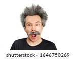 Small photo of Portrait of jocular aging man with grey long hair sticking his tongue out in Einstein manner. Isolated on background.