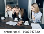 Small photo of Three young man discuss importat hard working question with cup of coffee.