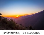 Small photo of Mountains layered views from the top of Nag Tibba base camp located in Dehradun Uttarakhand India. Sunset view of the natural beauty in Nag Tibba trek located in Dehradun Uttarakhand India. - Image