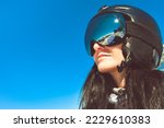 Close up skiers female person goggles with mountains panorama reflection. Ski holiday in caucasus mountains