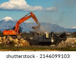 Small photo of Stone filled crusher with stone crusher and bucket