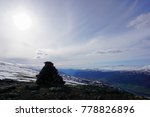 Large Rock Cairn Atop Snowy...