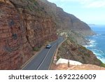 Small photo of Chapman's Peak Drive, Cape Peninsula / South Africa - March 10 2020 : A car travel on scenic cliff side coastal road called Chapman's Peak Drive of affectionately called "Chappies" in South Africa.