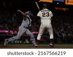 Small photo of San Francisco - June 8, 2022: Colorado Rockies catcher Elias Diaz attempts to throw out a running as San Francisco Giants outfielder Joc Pederson watches at Oracle Park.