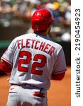 Small photo of Oakland, California - August 10, 2022: Los Angeles Angels infielder David Fletcher in the on deck circle during a game against the Oakland Athletics at the Oakland Coliseum.