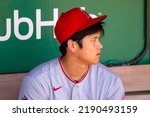 Small photo of Oakland, California - August 10, 2022: Los Angeles Angels DH Shohei Ohtani in the dugout before a game against the Oakland Athletics at the Oakland Coliseum.