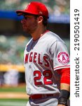 Small photo of Oakland, California - August 10, 2022: Los Angeles Angels infielder David Fletcher walks to the dugout during a game against the Oakland Athletics at the Oakland Coliseum.