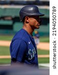 Small photo of Oakland, California - August 21, 2022: Seattle Mariners outfield Julio Rodriguez stands in the on deck circle during a game against the Oakland Athletics at the Oakland Coliseum.