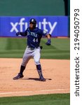 Small photo of Oakland, California - August 21, 2022: Seattle Mariners outfield Julio Rodriguez celebrates an RBI single against the Oakland Athletics at the Oakland Coliseum.