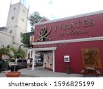 Small photo of King and George St. Downtown, Nassau, The Commonwealth of the Bahamas - 7 March 2019 : Pirates of Nassau Museum and Gift Shop