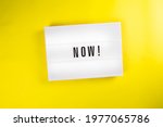 Lightbox with message NOW isolated on yellow background. Concept of motivation, hurry up sale announcement, start, beginning, buy now, register, join immediately, in stock, new trends, presently
