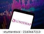Small photo of June 4, 2022, Brazil. In this photo illustration, the logo of the Uniswap, a cryptocurrency exchange that uses a decentralized network protocol is displayed on a smartphone screen
