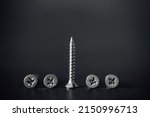Small photo of Macro photo of screws. Set of screws. Construction abstraction. Industrial background. Screws macro photo, screw background, steel screw, screw macro.