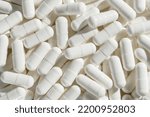 Capsules with medicine, vitamins or sports supplement close-up.