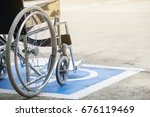 Pavement handicap symbol and wheelchair