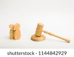 Small photo of Three men and a hammer of the judge. The trial of cases in court, the resolution of a dispute between two people. Business relations, ascertaining the ownership of property. Litigation.