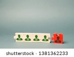 Small photo of Wooden puzzles with the image of workers. The concept of personnel management in the company. Dismissing an employees from a team. Demotion. Bad worker. Staff cuts. Human resources. Demote