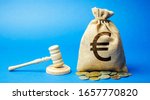 Small photo of Money bag and judge's hammer. Penalty for a crime and offense. Financial punishment. Violations of traffic laws. Fraud. Fine, penalization, mulct. Gavel. Euro