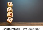 Small photo of Wooden blocks with word SPAC. Special-purpose acquisition company. A easy way stock exchange financial instrument for attracting investments. Development of new simplified procedures for investment