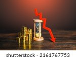 Small photo of Money, sandglass and down arrow. Decrease in hourly pay wages. Save savings from inflation. Income falling. Dropping mortgage rates. Decreasing return on investment over time. Reducing costs, prices