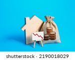 Small photo of House and falling income. Decreased property value. Crisis in the real estate market. Falling prices for rental. Low demand on housing. Saving and reducing the cost of maintaining and paying bills.