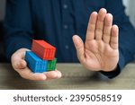 Small photo of Shipping containers and a stop gesture. Refusal and blocking. Break a trade deal. Economic embargo. Sanctions, ban on insurance of ships and cargo. Restrictions on the sale of dual-use goods.